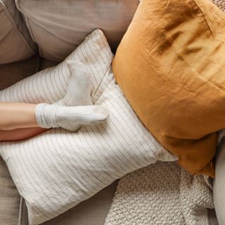 Foxtrot Home French Flax Linen styled in a bedroom with Tobacco Stripes Cushion Cover.