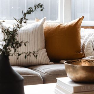 Foxtrot Home French Flax Linen styled in a bedroom with Tobacco Stripes Cushion Cover.