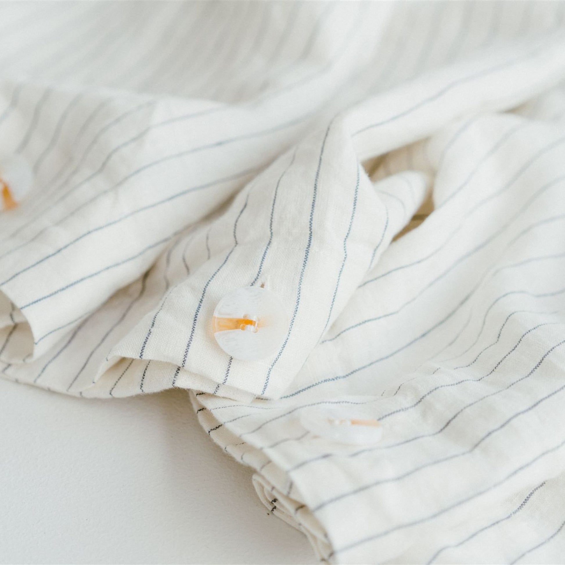 Foxtrot Home French Flax Linen styled in a bedroom with Coastal Blue Stripes Duvet