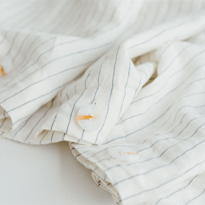 Foxtrot Home French Flax Linen styled in a bedroom with Coastal Blue Stripes Duvet