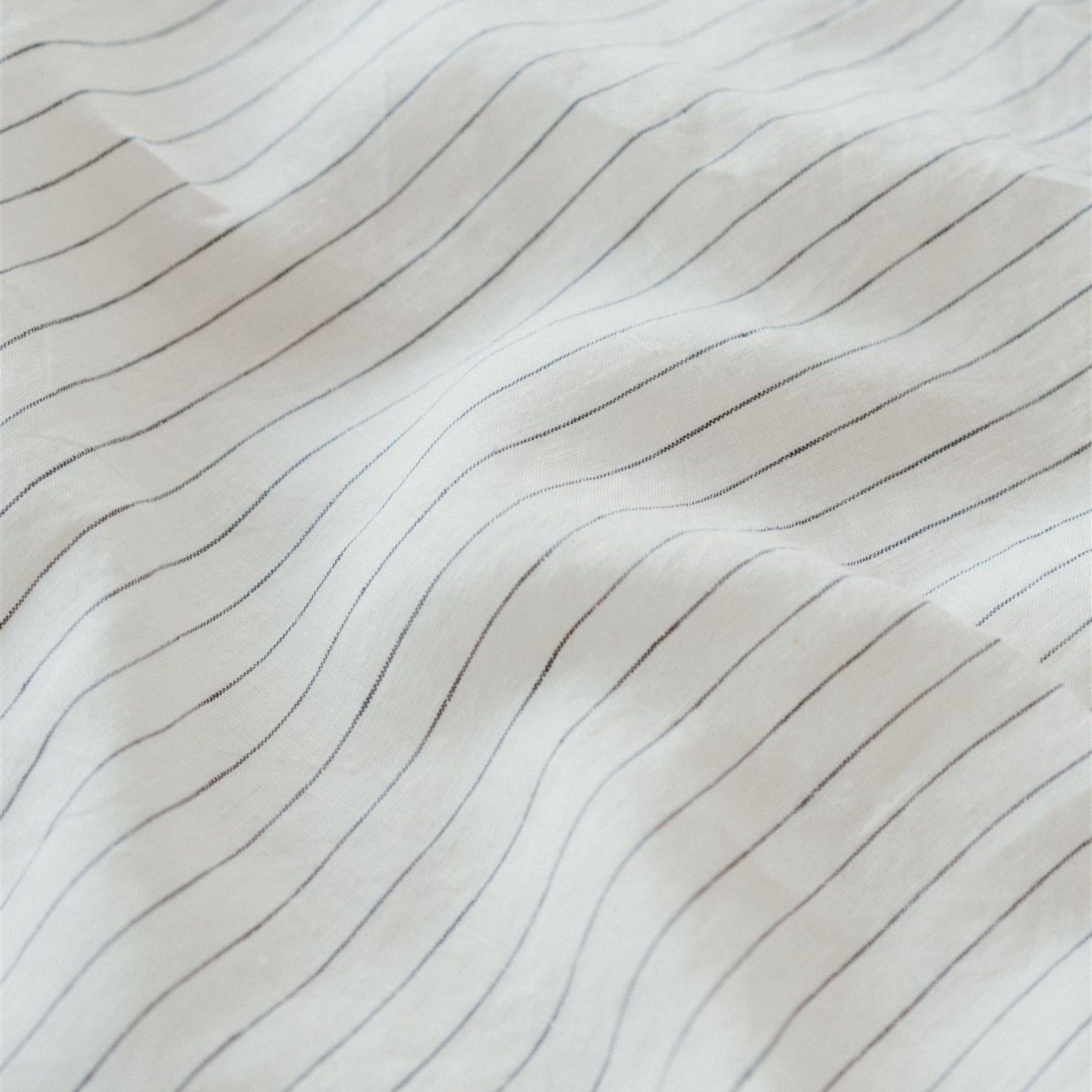 Foxtrot Home French Flax Linen styled in a bedroom with Coastal Blue Stripes Duvet