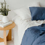 Foxtrot Home French Flax Linen styled in a bedroom with Coastal Blue Stripes Fitted Sheet