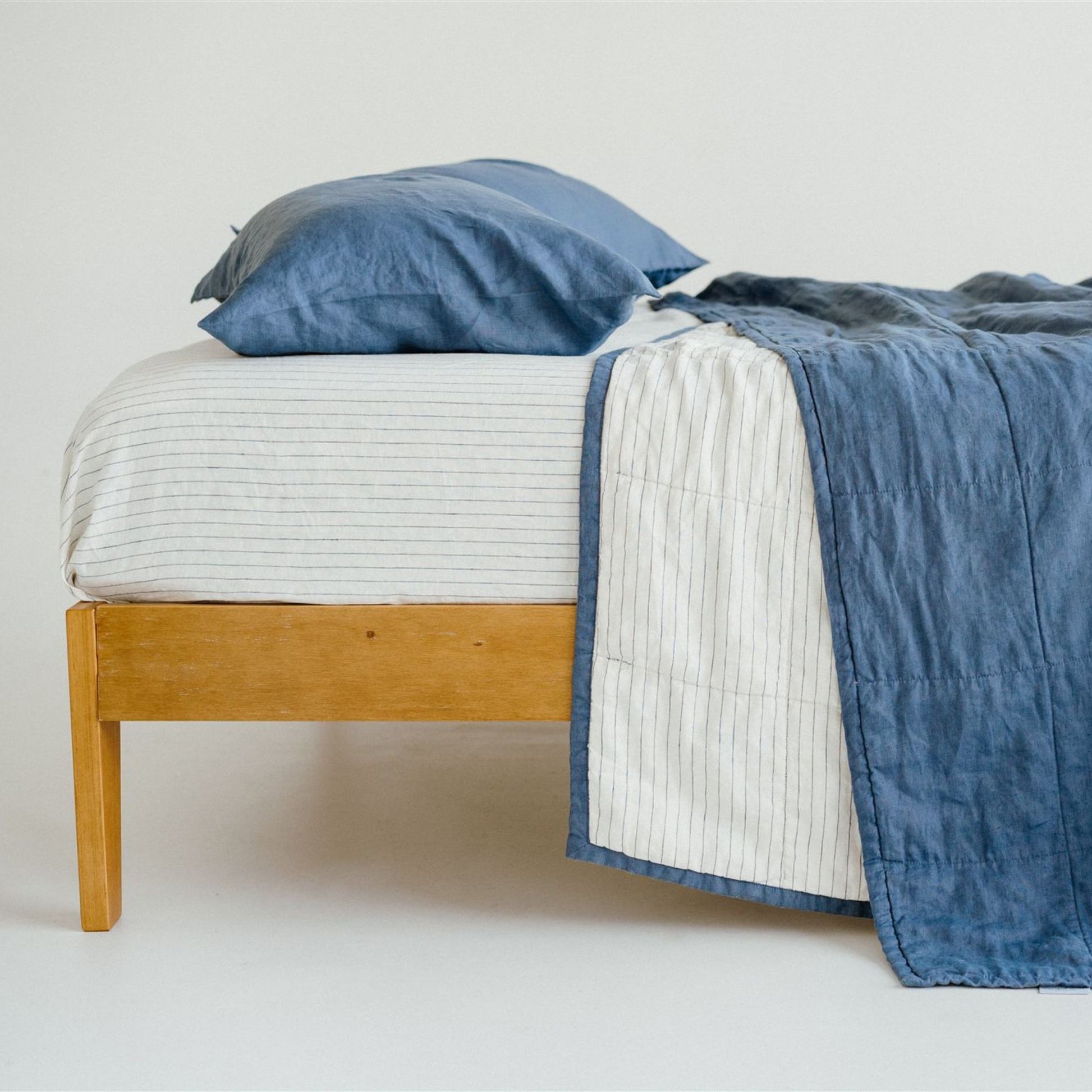 Foxtrot Home French Flax Linen Coastal Blue Quilt with Coastal Blue Stripes on reverse