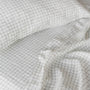 Foxtrot Home French Flax Linen styled in a bedroom with Cactus Grid Fitted Sheet.