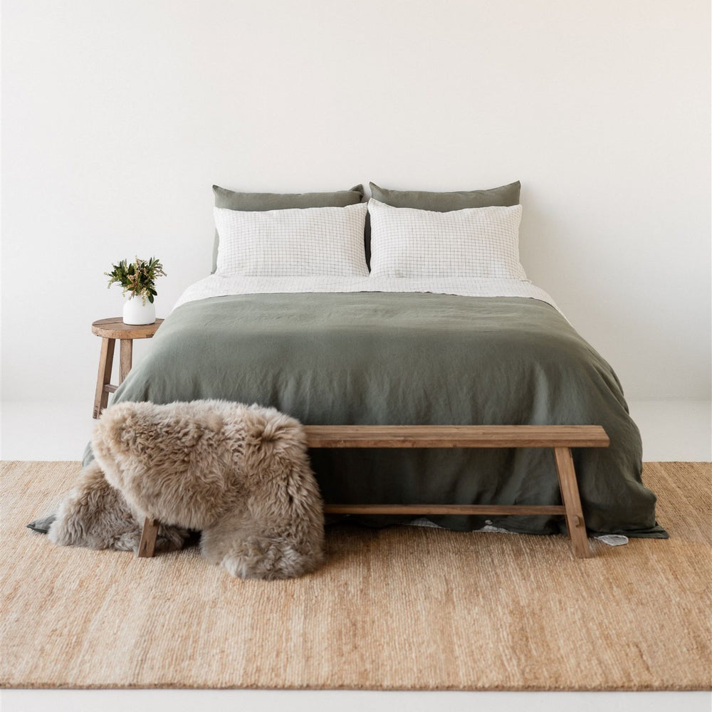 Foxtrot Home French Flax Linen styled in a bedroom with Cactus Grid Sheet Set and a Cactus Duvet.