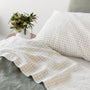 Foxtrot Home French Flax Linen styled in a bedroom with Cactus Grid Fitted Sheet.