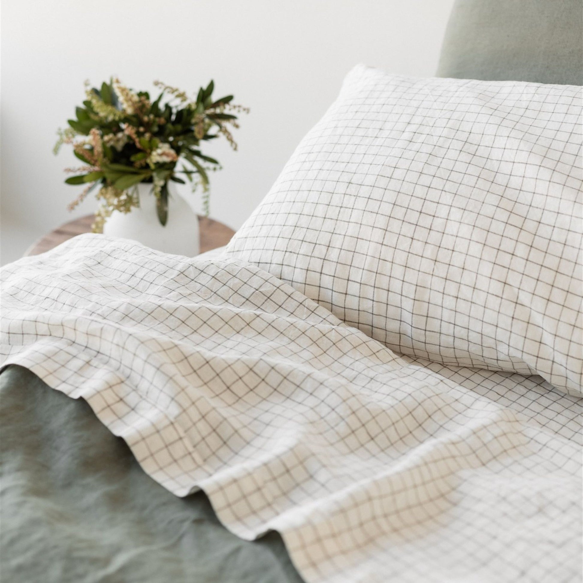 Foxtrot Home French Flax Linen styled in a bedroom with Cactus Grid Fitted Sheet.