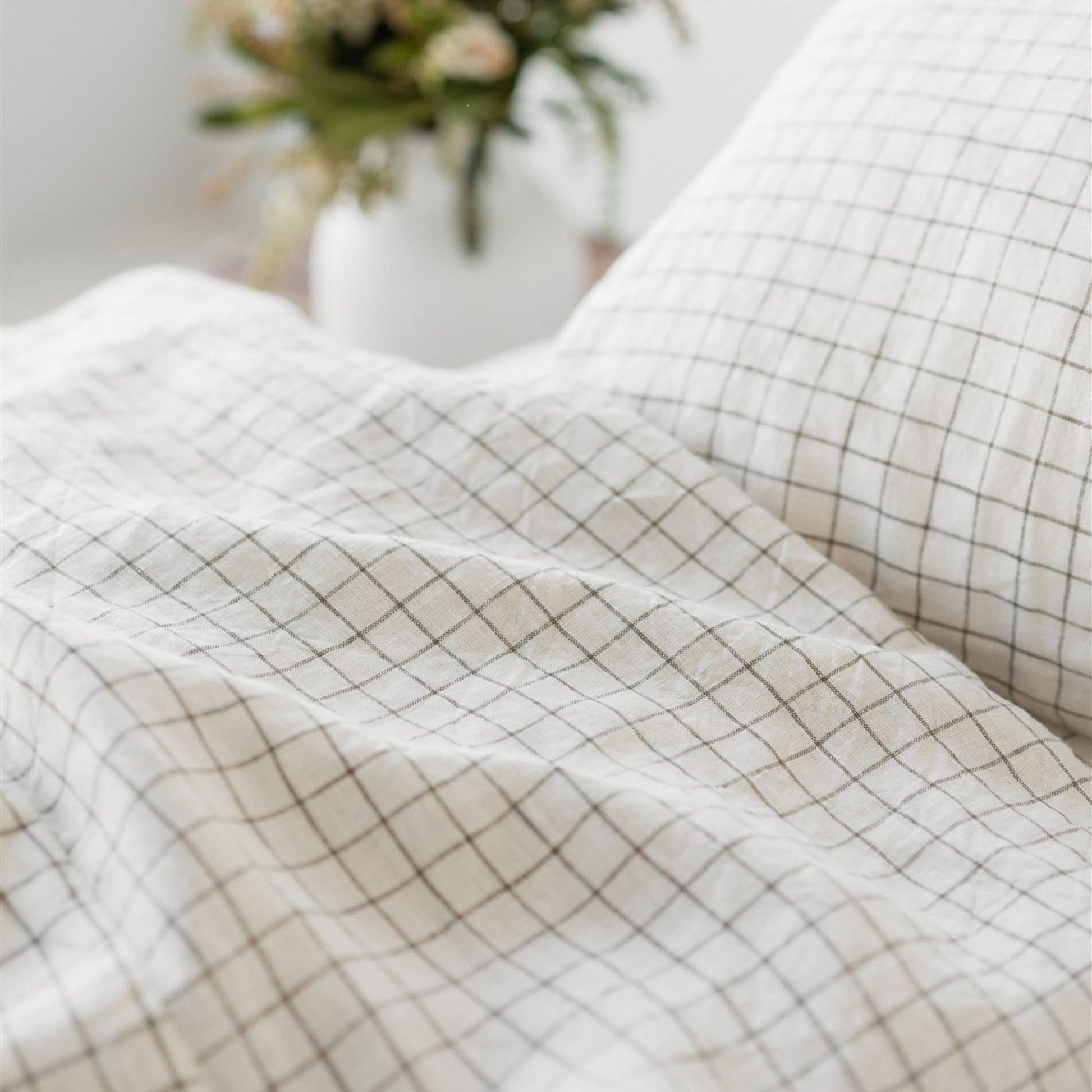 Foxtrot Home French Flax Linen styled in a bedroom with Cactus Grid Fitted Sheet.