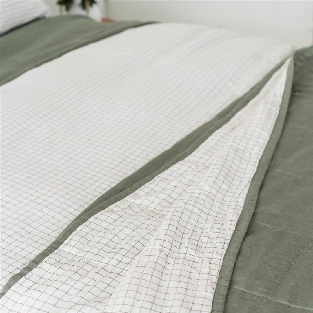 Foxtrot Home French Flax Linen styled in a bedroom with Cactus and Cactus Grid Quilt, Cactus Grid Duvet, Cactus Sheets Set and Pillowcases