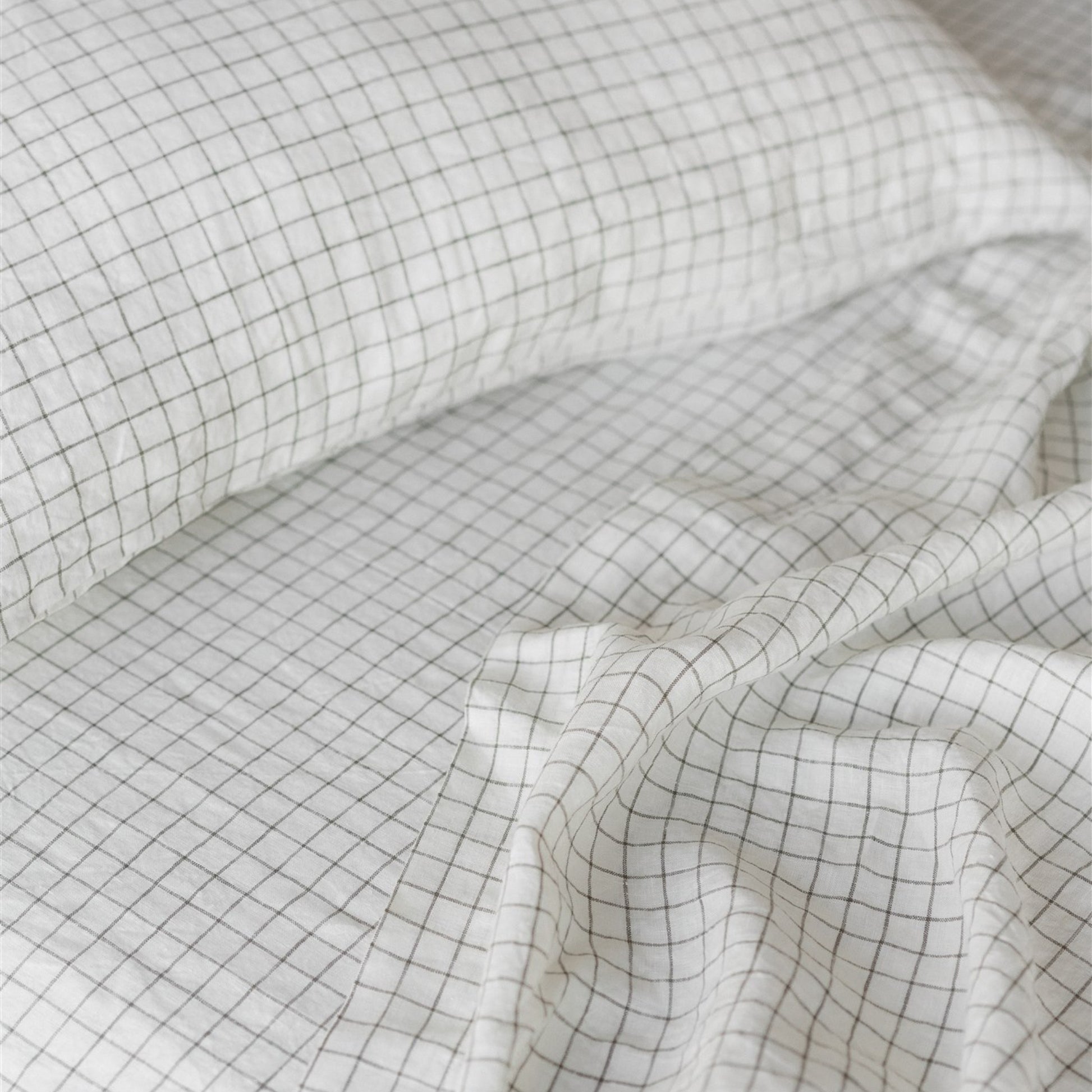 Foxtrot Home French Flax Linen styled in a bedroom with Cactus Grid Duvet, Cactus Sheets Set and Pillowcases