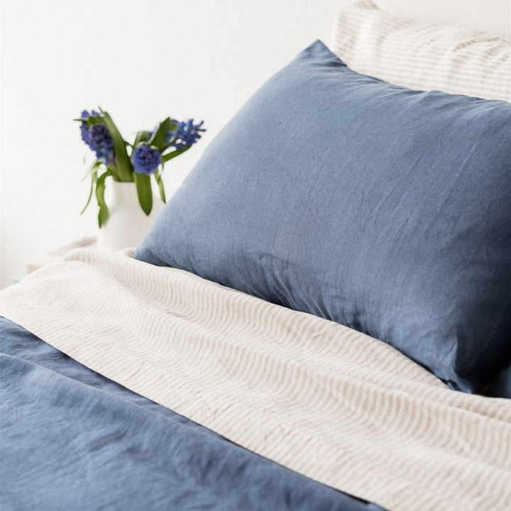 Foxtrot Home French Flax Linen styled in a bedroom with Coastal Blue Pillowcases.