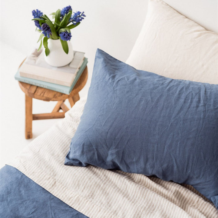 Foxtrot Home French Flax Linen styled in a bedroom with Coastal Blue Pillowcases.