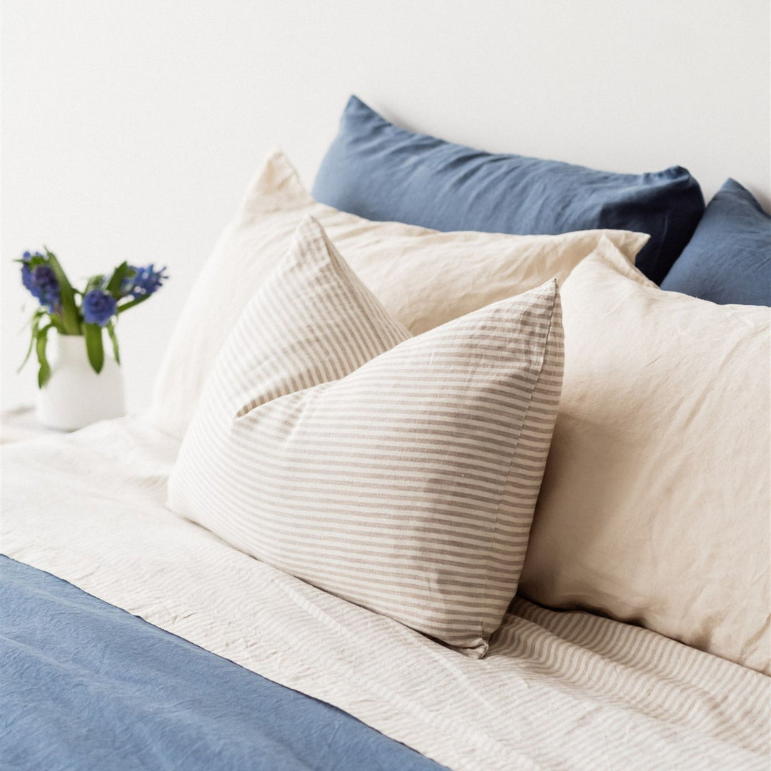 Foxtrot Home French Flax Linen styled in a bedroom with Coastal Blue Duvet