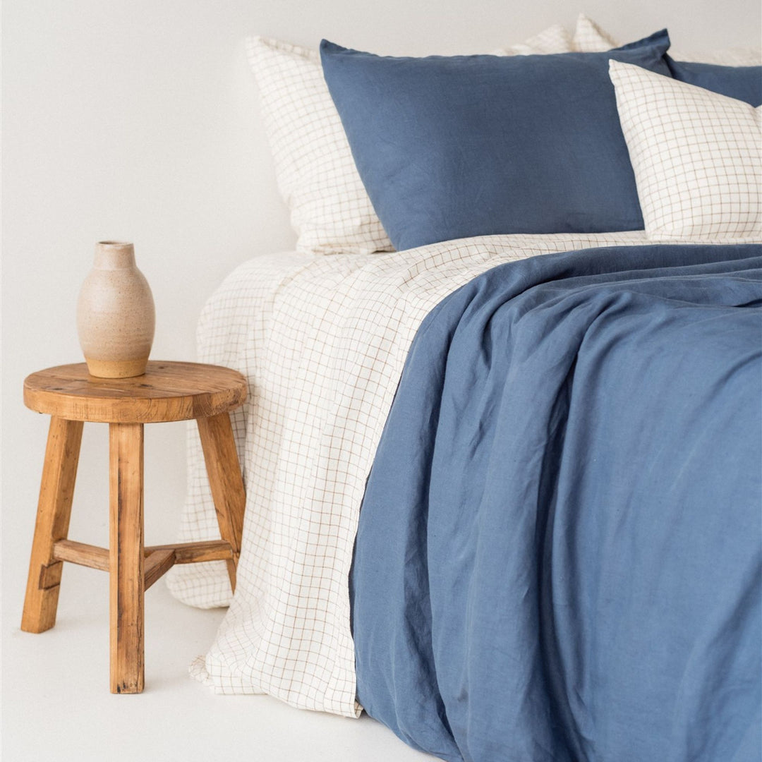 Foxtrot Home French Flax Linen styled in a bedroom with Coastal Blue Pillowcases.