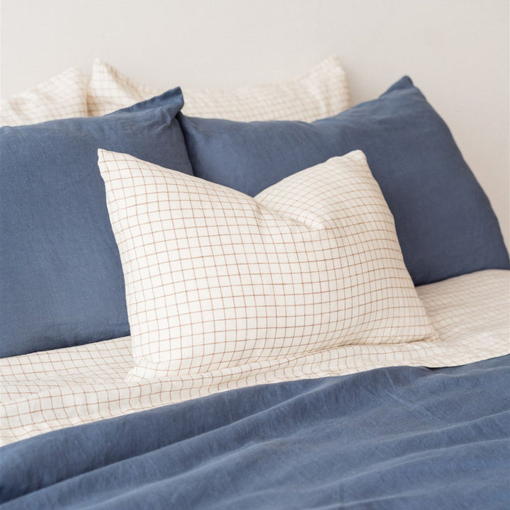 Foxtrot Home French Flax Linen styled in a bedroom with Coastal Blue Duvet