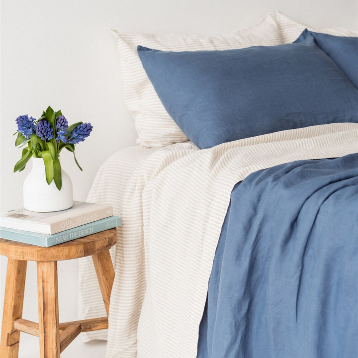 Foxtrot Home French Flax Linen styled in a bedroom with Coastal Blue Pillowcases.