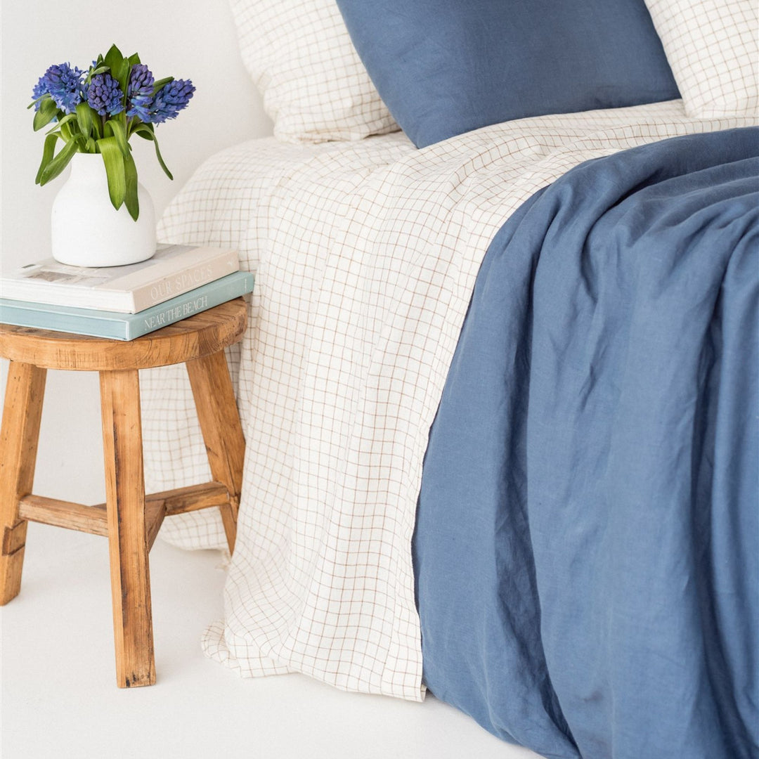 Foxtrot Home French Flax Linen styled in a bedroom with Coastal Blue Duvet