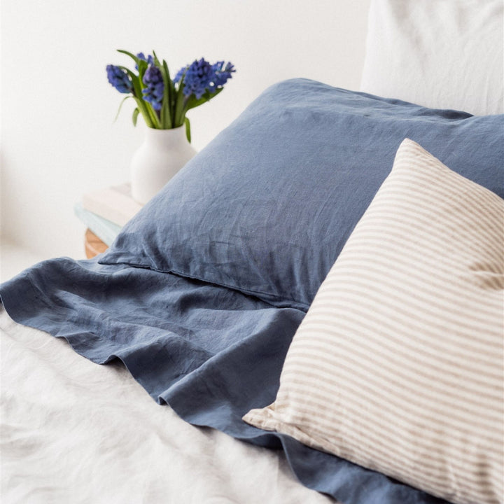 Foxtrot Home French Flax Linen styled in a bedroom with a Coastal Blue Flat Sheet