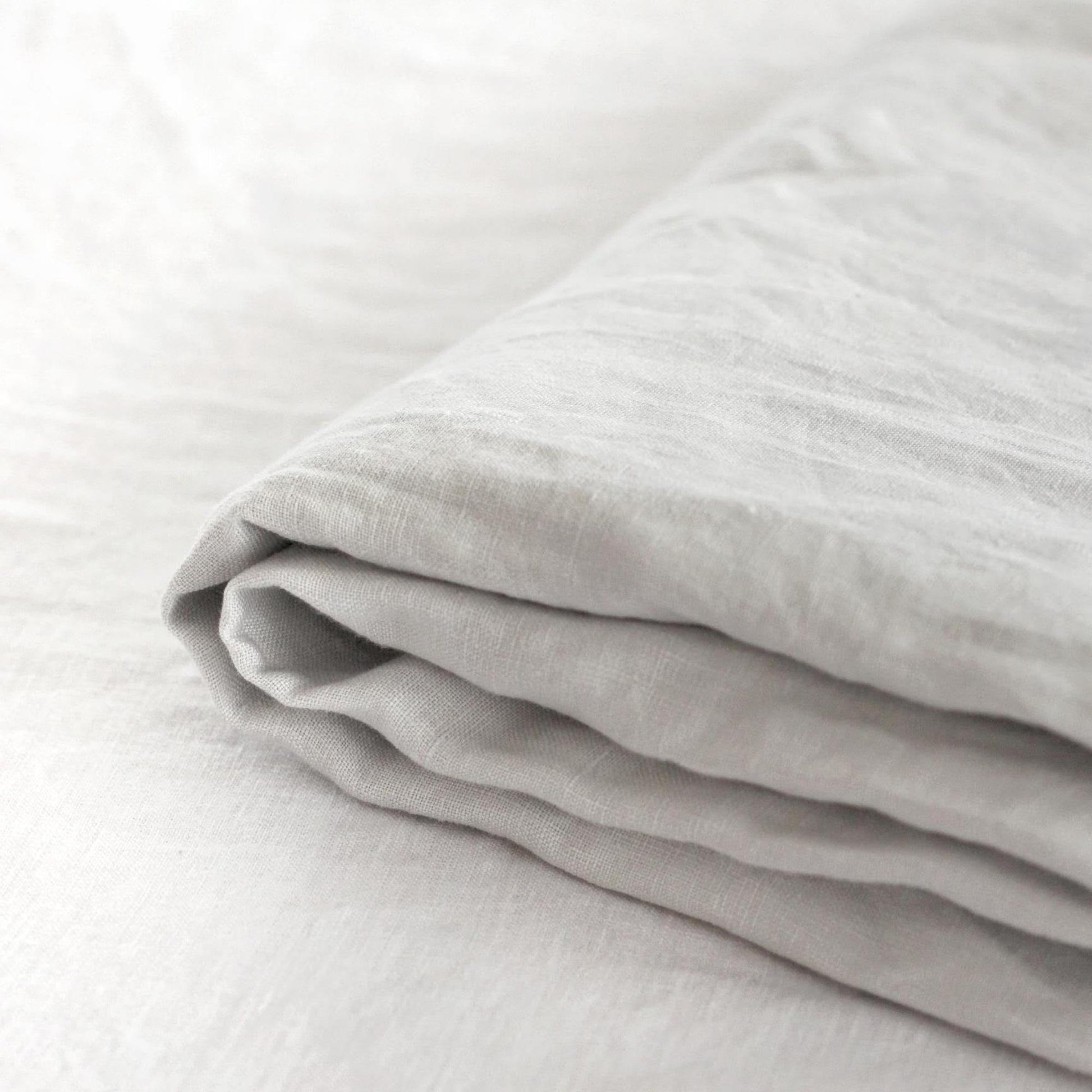 Foxtrot Home French Flax Linen styled in a bedroom with Light Grey Flat Sheet