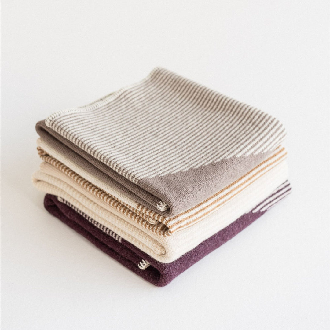 Foxtrot Home New Zealand Wool Throw Blankets in Geometric pattern staked in four colours, Fig Pampas Ginger Honey and Mushroom