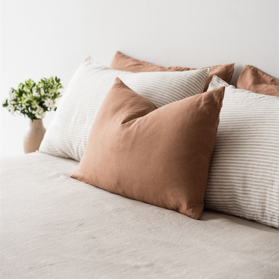 Foxtrot Home French Flax Linen styled in a bedroom with Malt Brown Rectangle Cushion Cover.