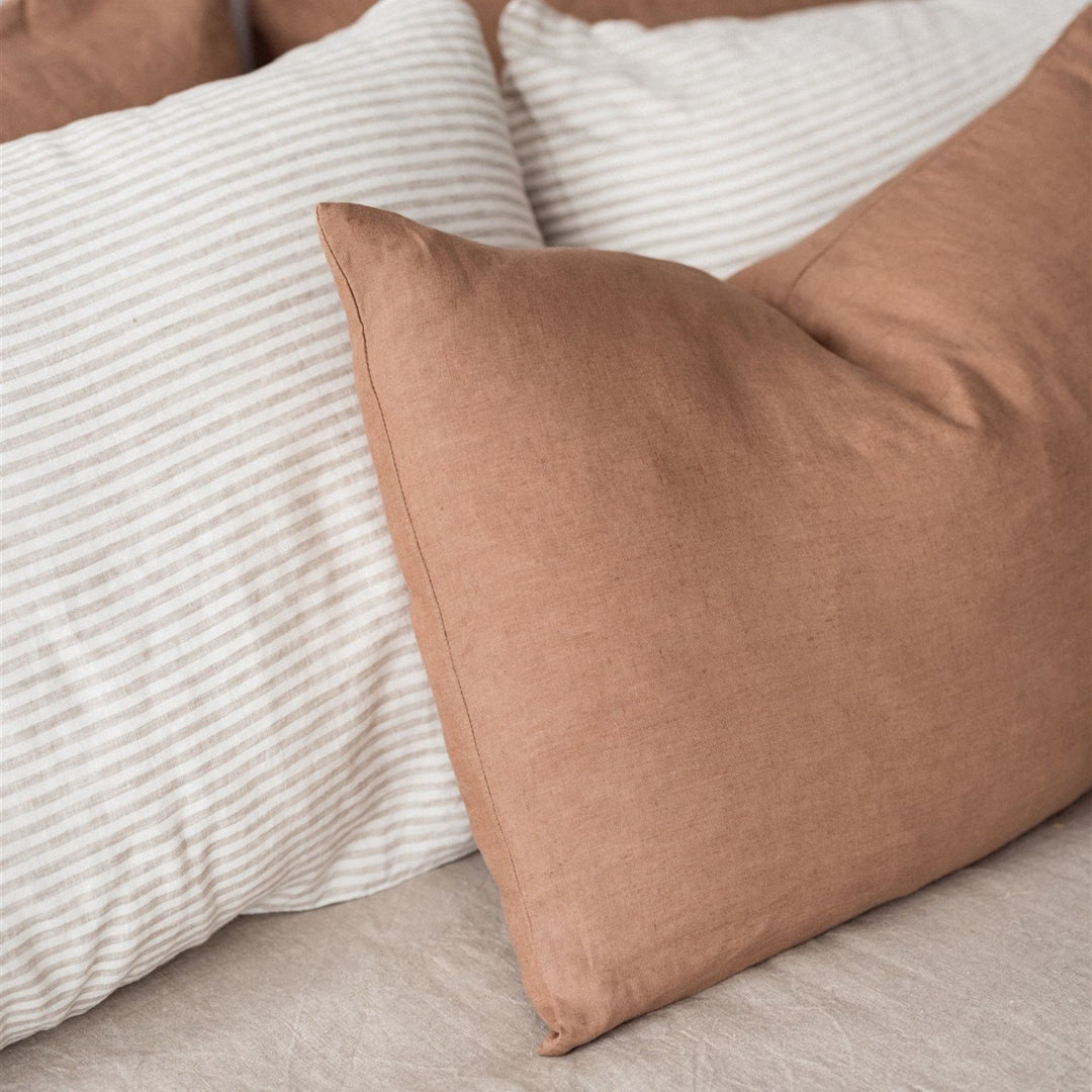 Foxtrot Home French Flax Linen styled in a bedroom with Malt Brown Rectangle Cushion Cover.