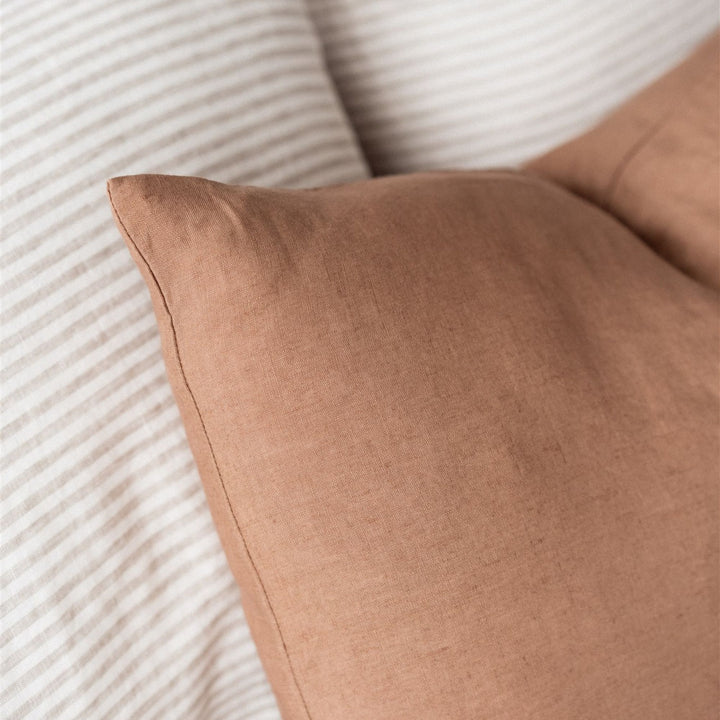 Foxtrot Home French Flax Linen styled in a bedroom with Malt Brown Rectangle Cushion Cover.