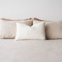 Foxtrot Home French Flax Linen styled in a bedroom with Malt Brown Grid Rectangle Cushion Cover.