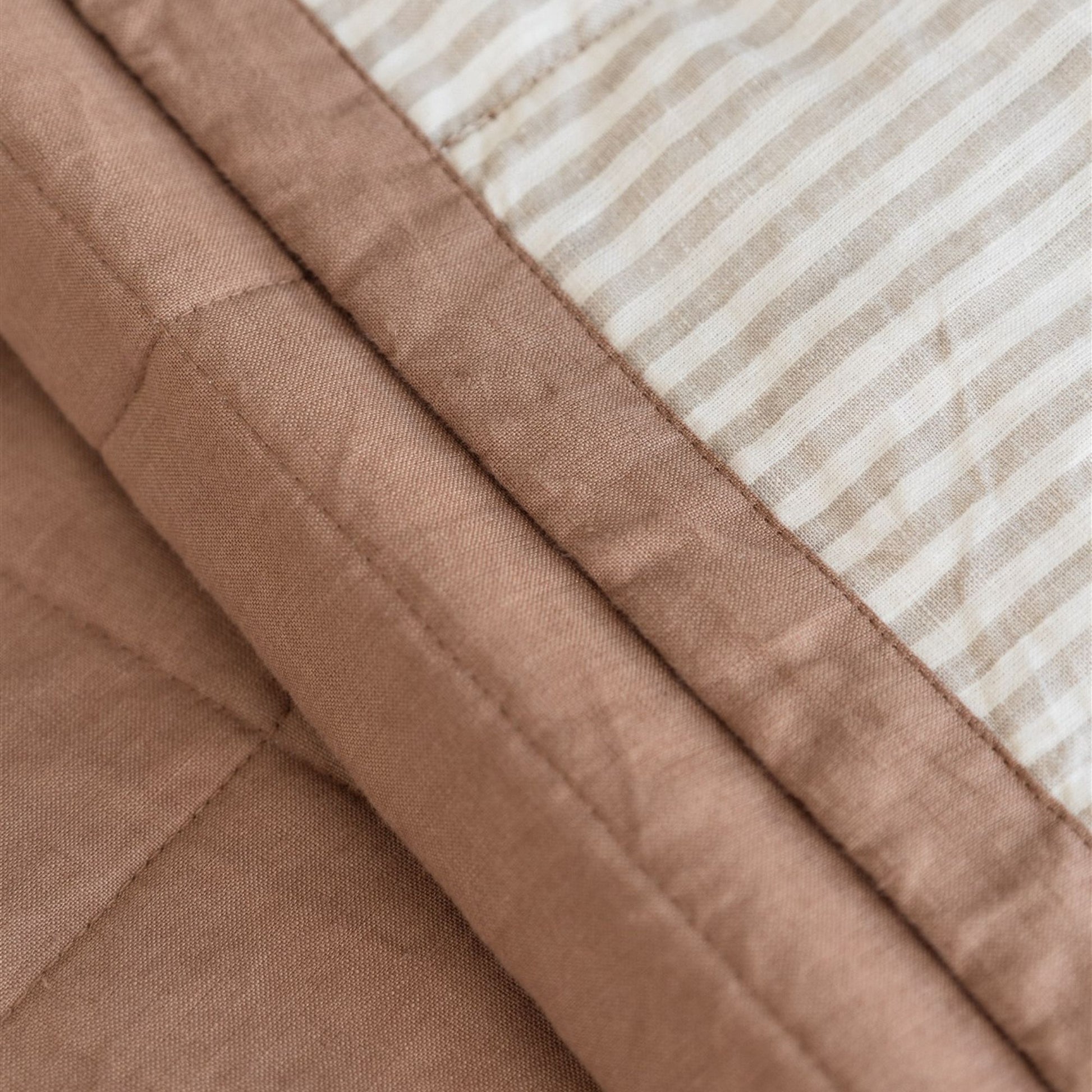 Foxtrot Home French Flax Linen styled in a bedroom with Malt Brown and Sand Stripes Quilt