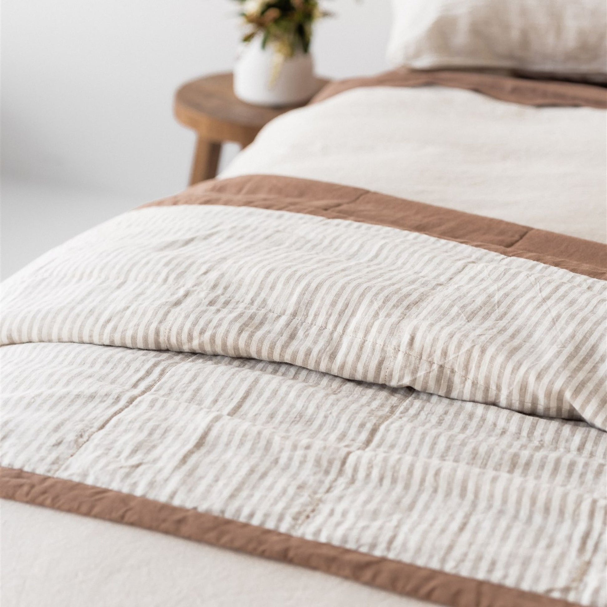 Foxtrot Home French Flax Linen styled in a bedroom with Malt Brown and Sand Stripes Quilt