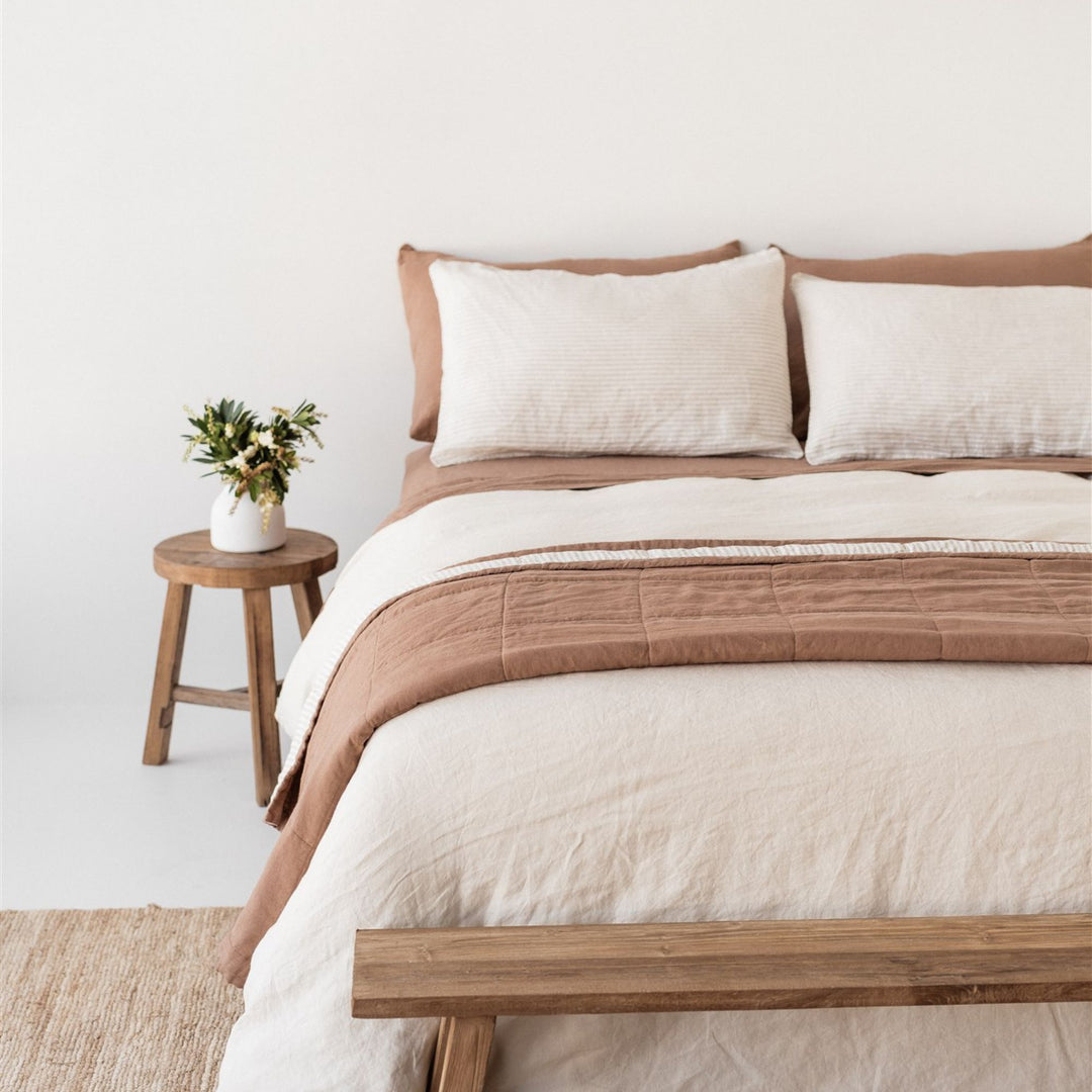 Foxtrot Home French Flax Linen styled in a bedroom with Malt Brown and Sand Stripes Quilt