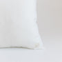 Foxtrot Home French Flax Linen styled in a bedroom with Off White Cushion Cover.