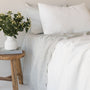 Foxtrot Home French Flax Linen styled in a bedroom with Off White Duvet.