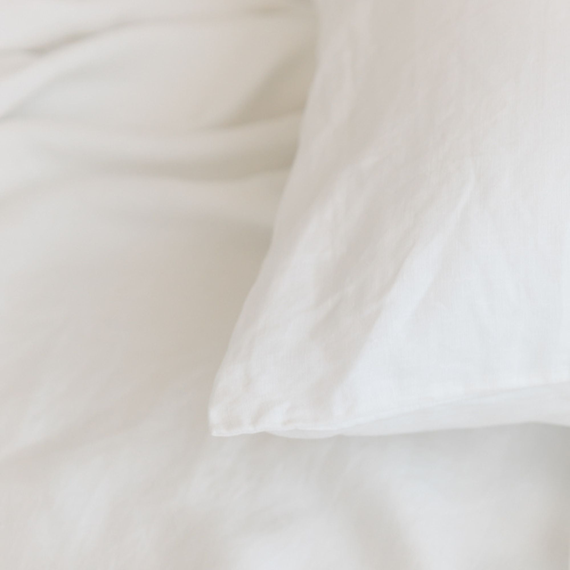 Foxtrot Home French Flax Linen styled in a bedroom with Off White Pillowcases.