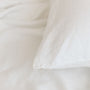 Foxtrot Home French Flax Linen styled in a bedroom with Off White Duvet.