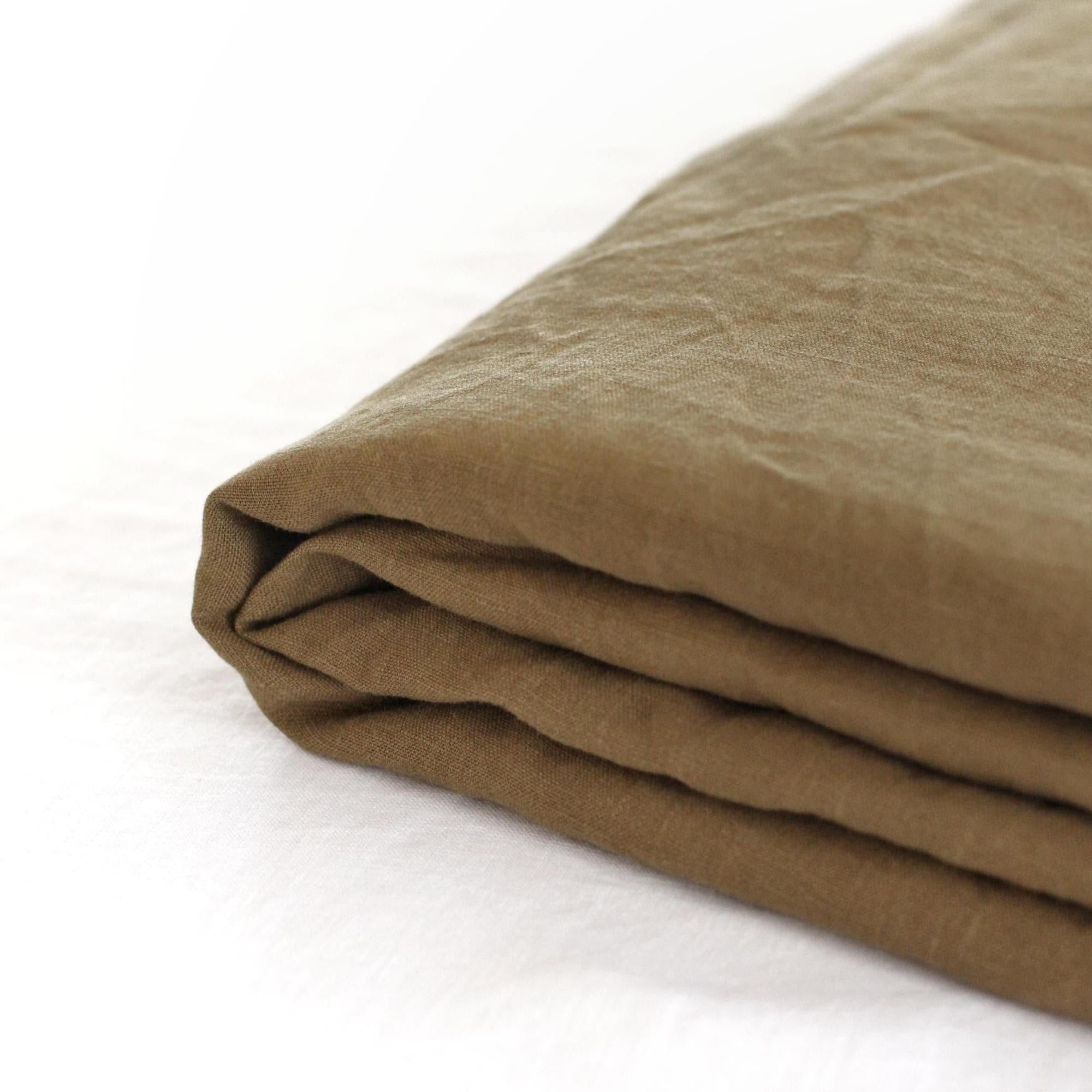 Foxtrot Home French Flax Linen styled in a bedroom with Olive Green Flat Sheet.