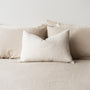 Foxtrot Home French Flax Linen styled in a bedroom with Sand Stripes Rectangle Cushion Cover.