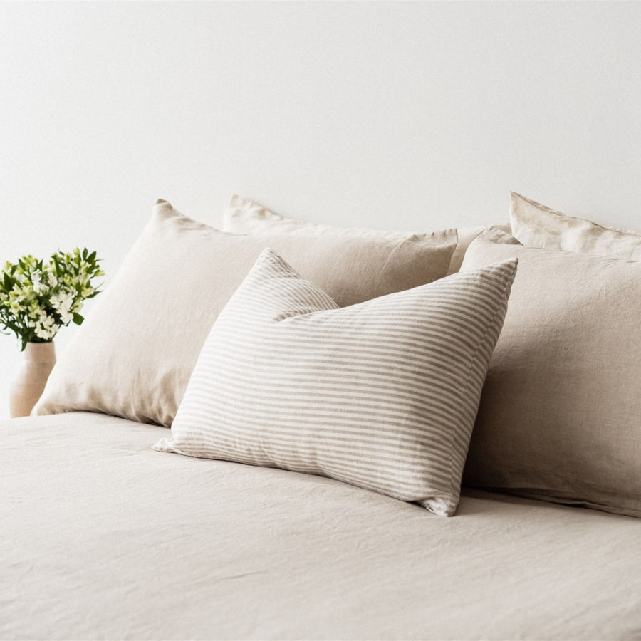 Foxtrot Home French Flax Linen styled in a bedroom with Sand Stripes Rectangle Cushion Cover.