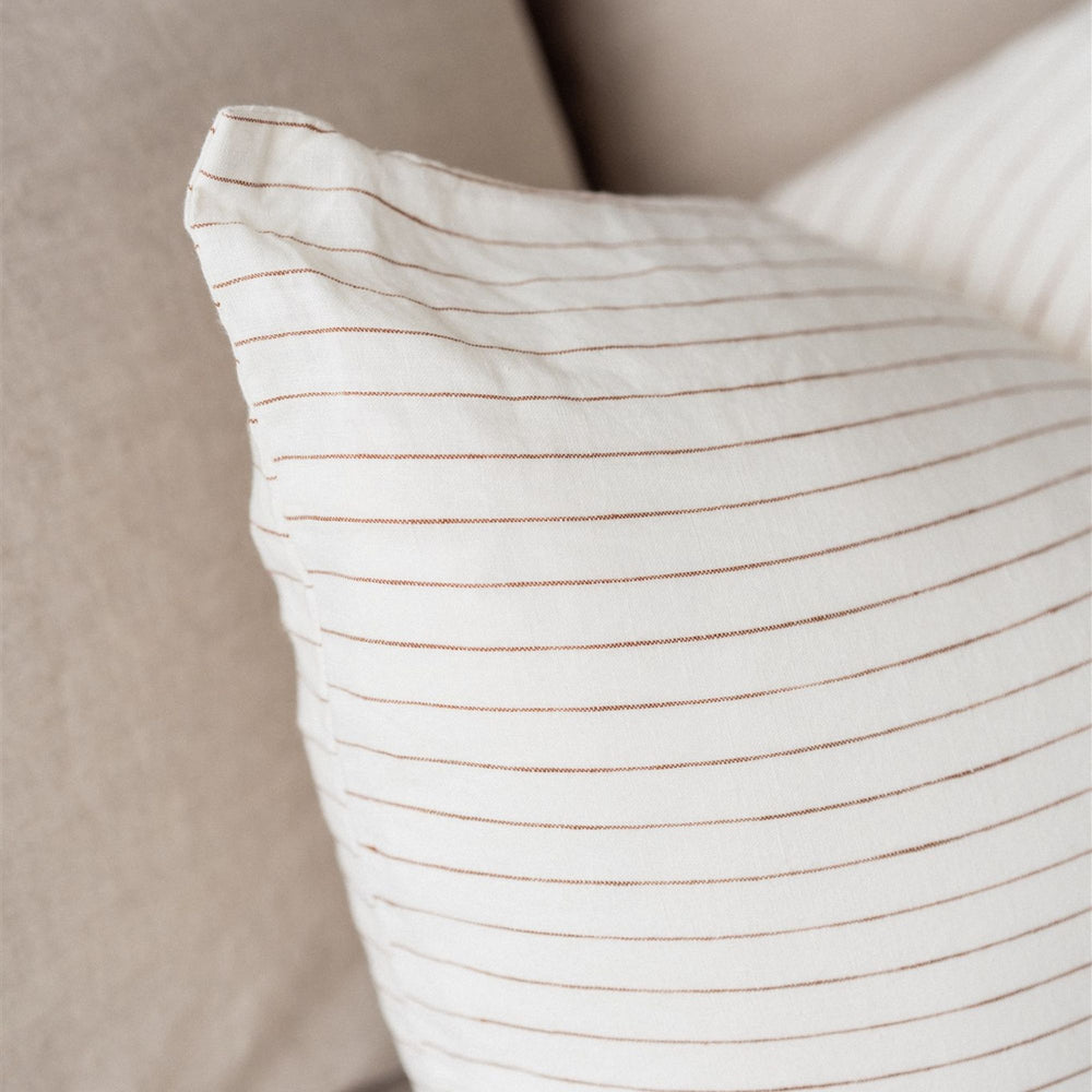 Foxtrot Home French Flax Linen styled in a bedroom with Tobacco Stripes Rectangle Cushion Cover.