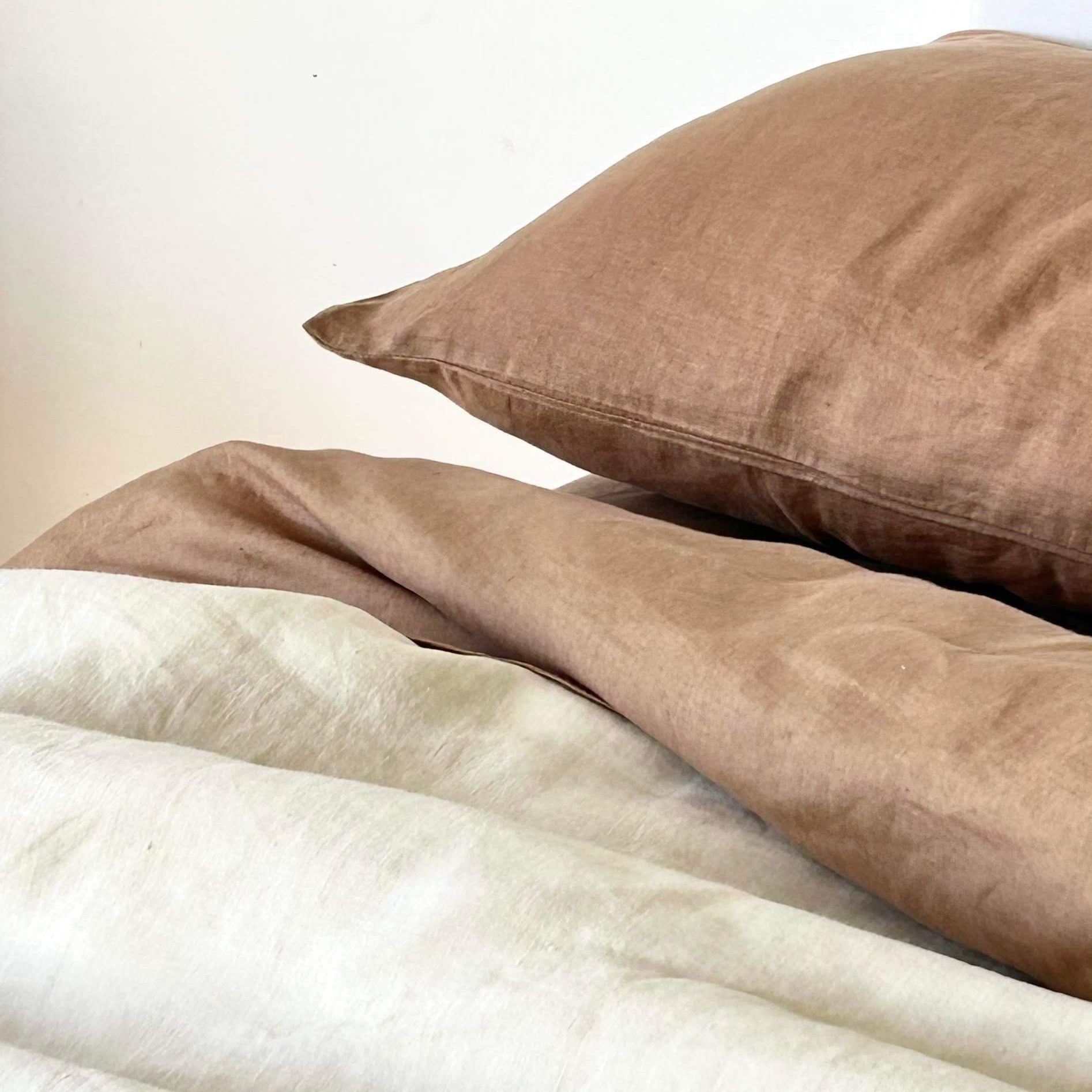 Foxtrot Home French Flax Linen styled with Malt Brown Sheets and an Oat Duvet