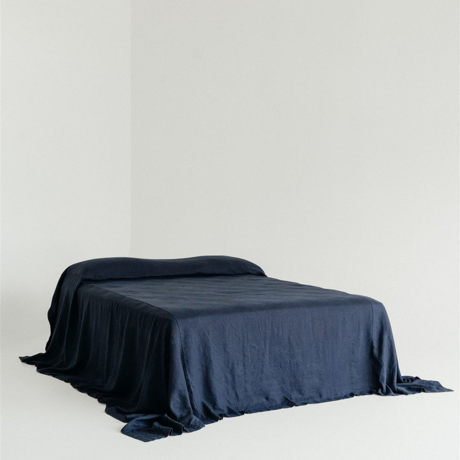Foxtrot Home French Flax Linen styled in a bedroom with Midnight Blue Bedspread