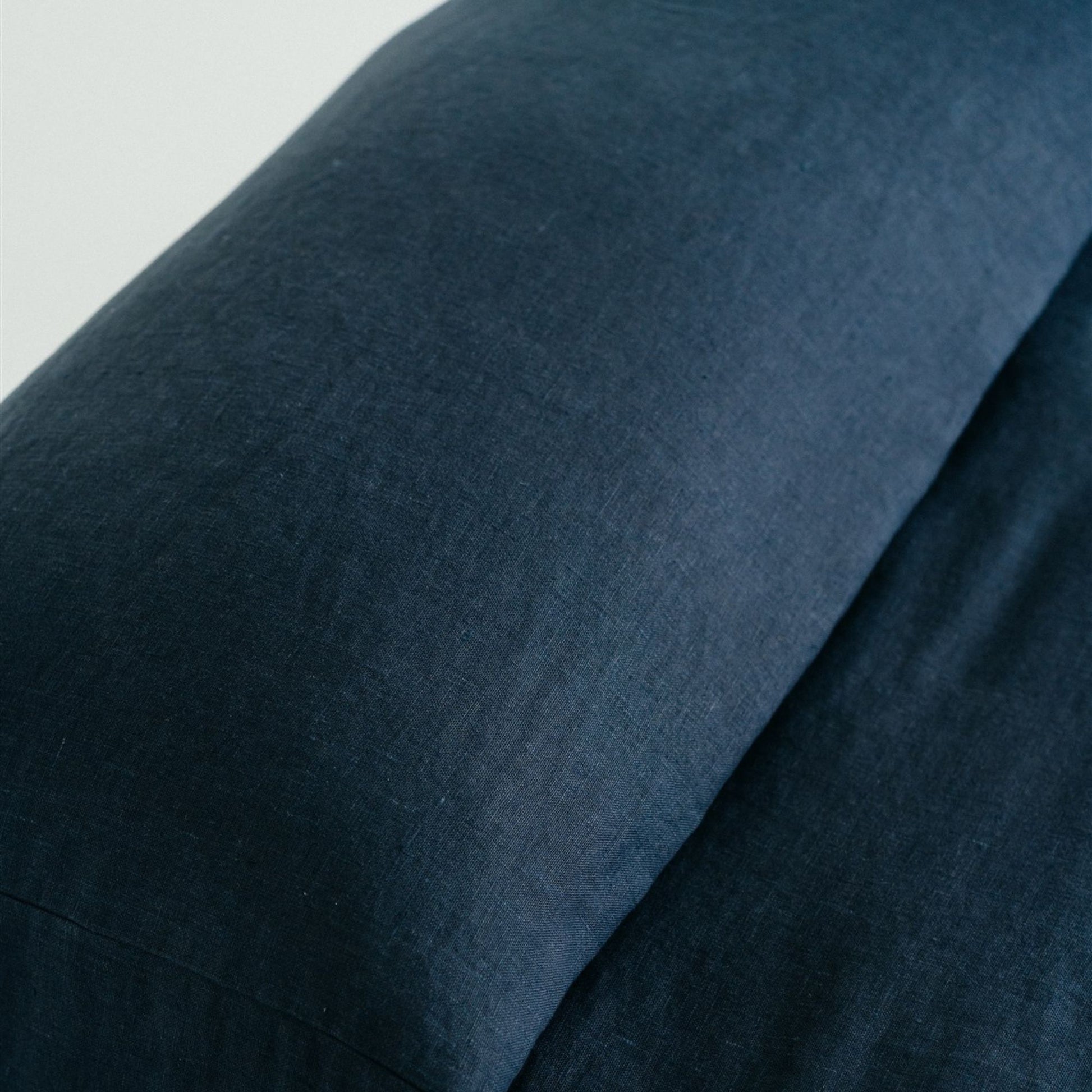 Foxtrot Home French Flax Linen styled in a bedroom with Midnight Blue Bedspread