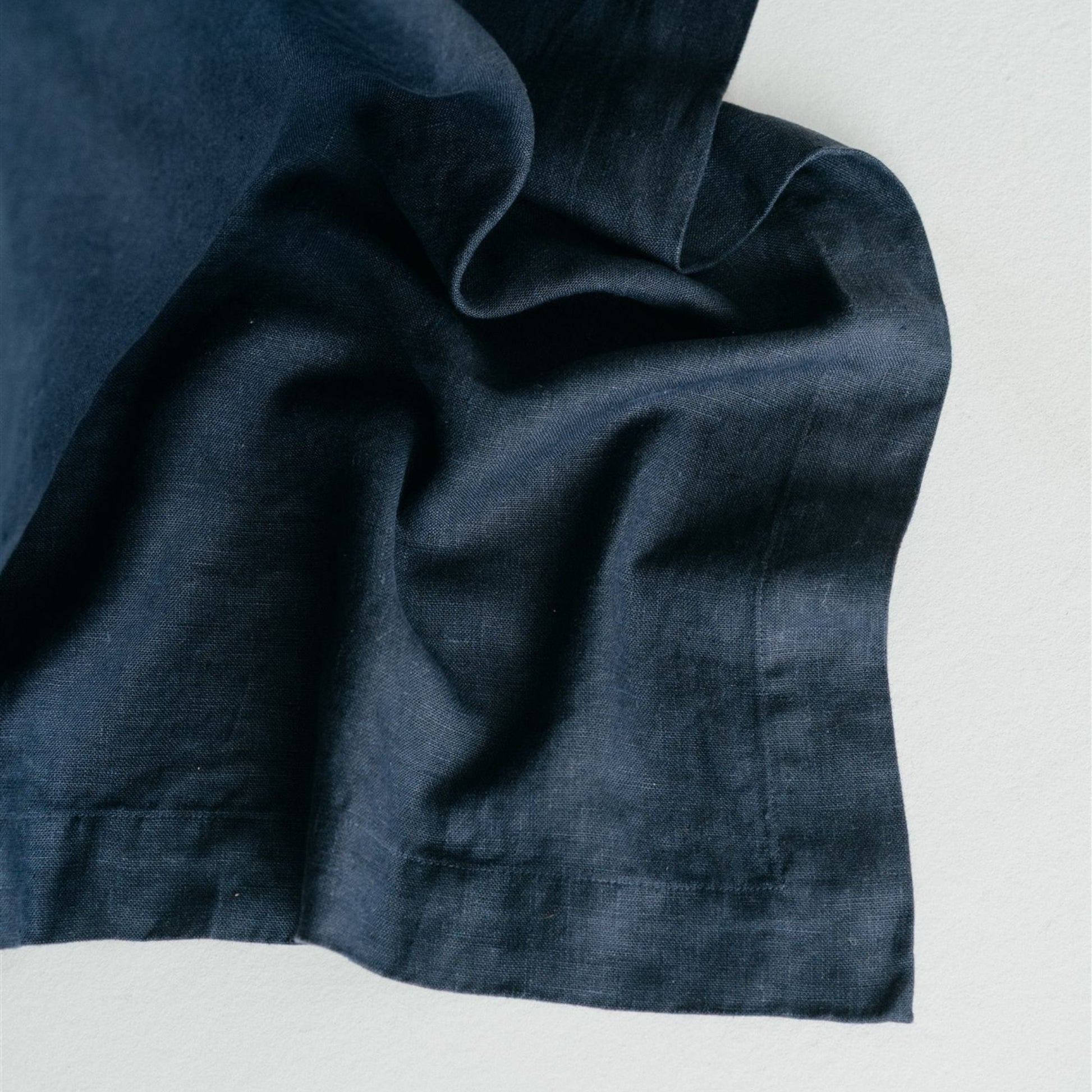 Foxtrot Home French Flax Linen styled in a bedroom with Midnight Blue Bedspread