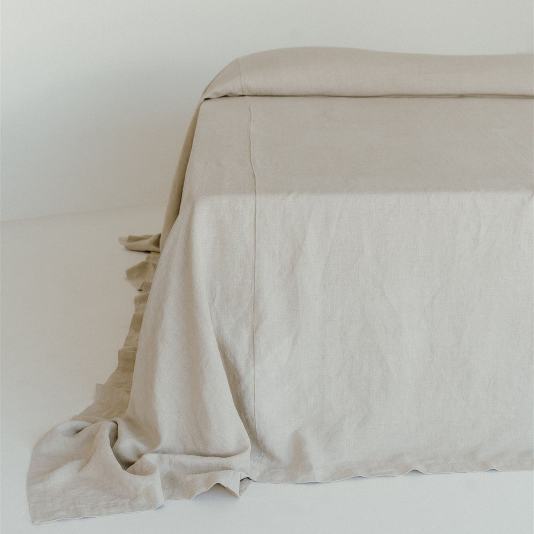 Foxtrot Home French Flax Linen styled in a bedroom with a Natural Bedspread