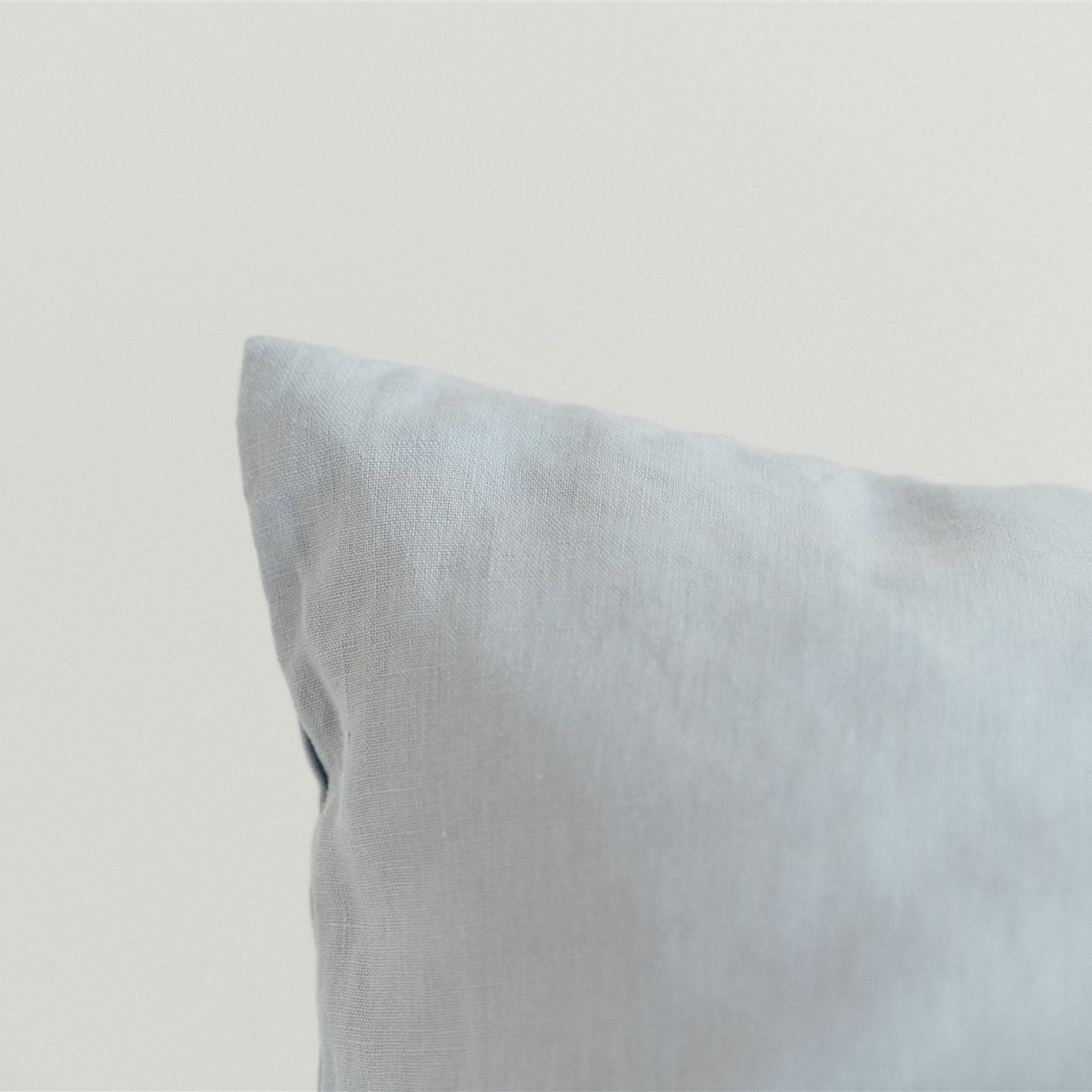 Foxtrot Home French Flax Linen styled in a bedroom with Powder Blue Cushion