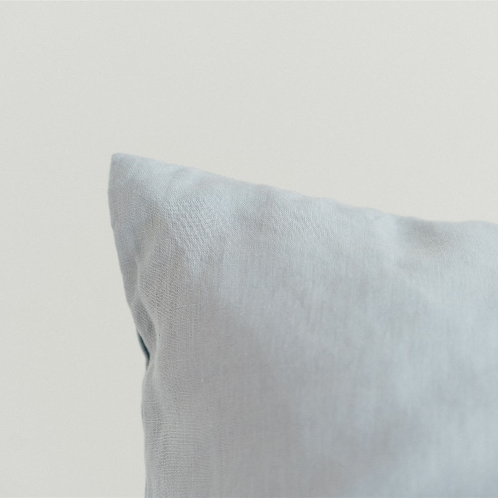 Foxtrot Home French Flax Linen styled in a bedroom with Powder Blue Cushion