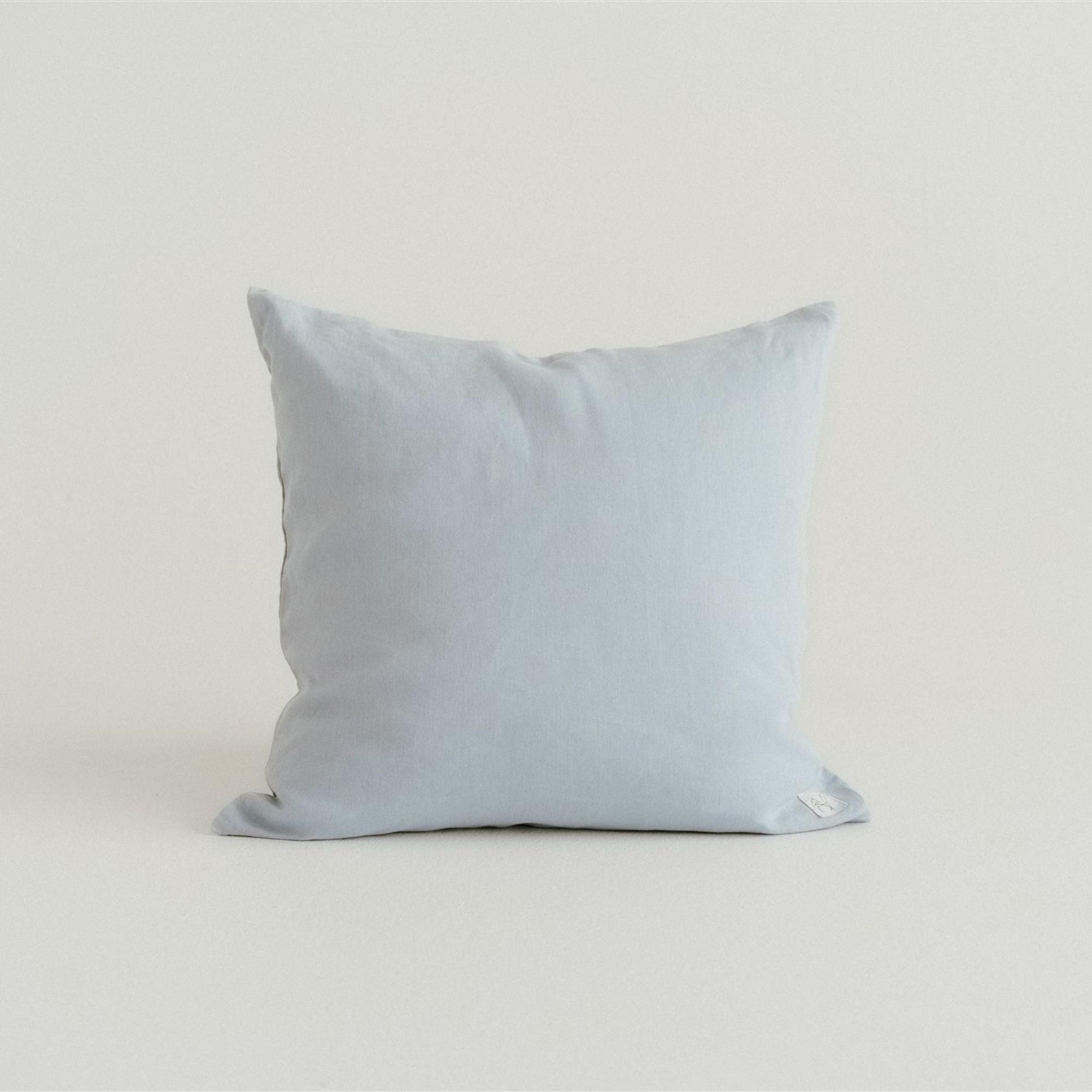 Foxtrot Home French Flax Linen styled in a bedroom with Powder Blue Cushion