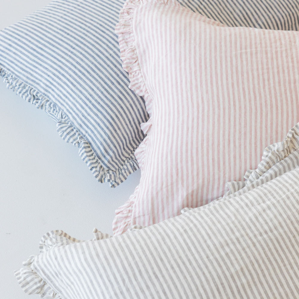 Foxtrot Home French Flax Linen styled in a bedroom with Stripes Ruffles Cushion Covers