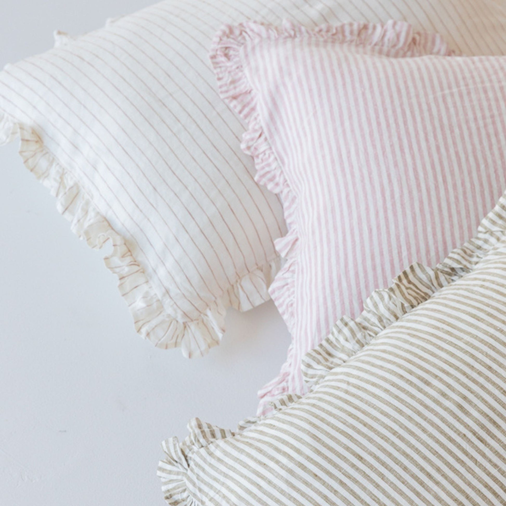 Foxtrot Home French Flax Linen styled in a bedroom with Stripes Ruffles Cushion Covers