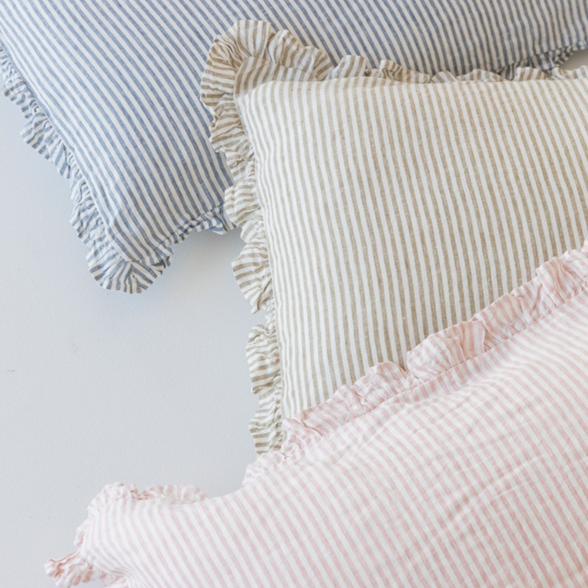 Foxtrot Home French Flax Linen styled in a bedroom with Stripes Ruffles Cushion Covers